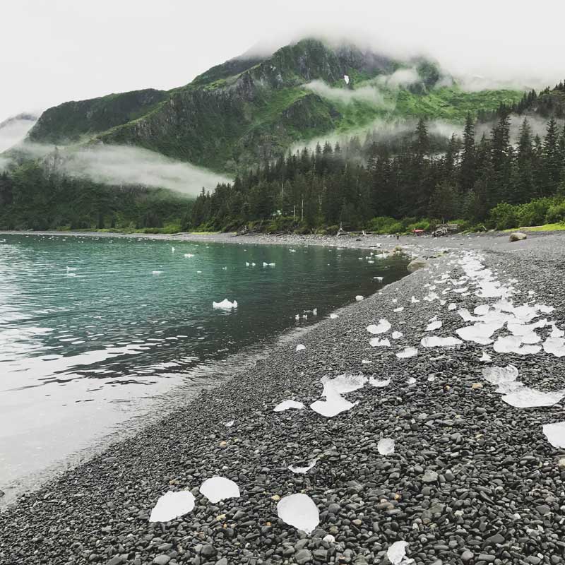 Brash Ice sits upon the beach in the National Park at the start of a Kayaking Trip