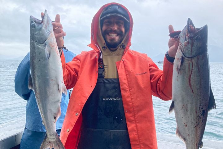 a person holding a fish