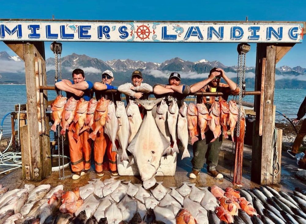 Millers Landing fishing Crew standing in front of the catch of the day